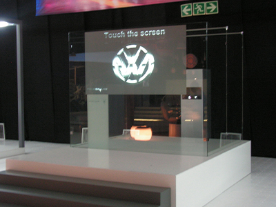 Interactive touch screen display featuring a logo.