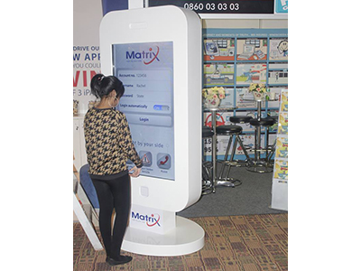 A large interactive touch kiosk on display at an event.
