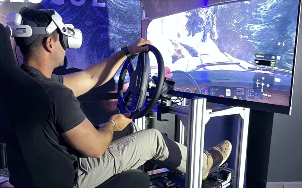 Person using a VR racing simulator with steering wheel setup