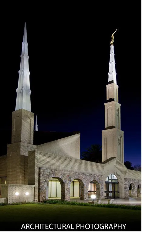 Night view of a building with distinctive spires