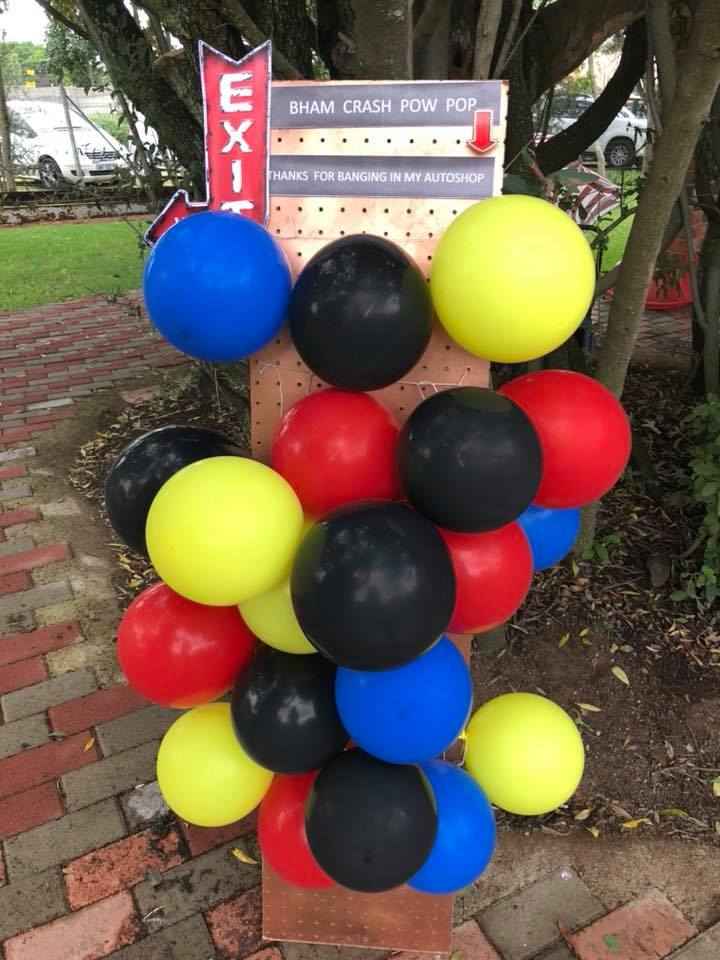 Colorful balloon display with red, yellow, blue, and black balls