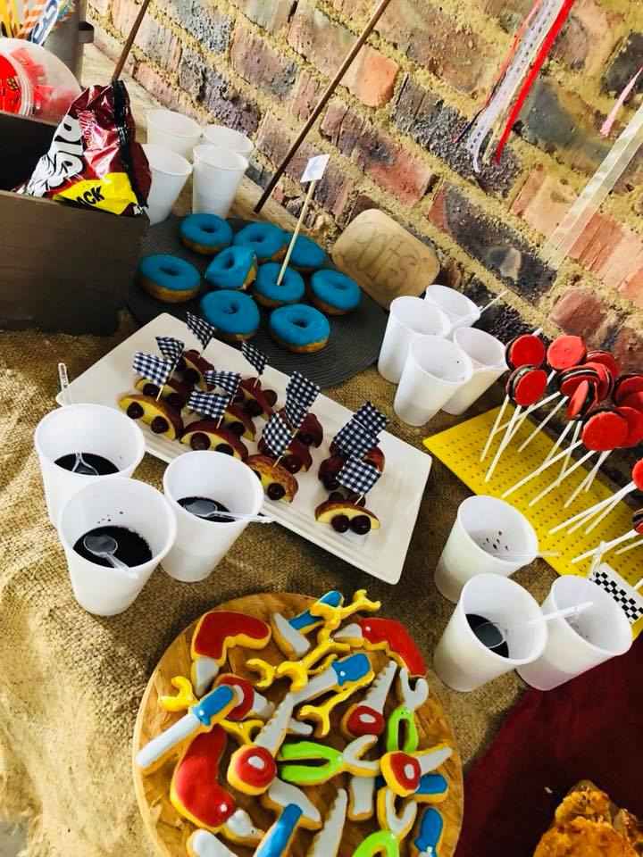Colorful kiddies' party snacks including donuts and cake pops.