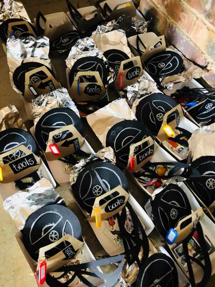 Row of neatly packed party favor kits with unique designs