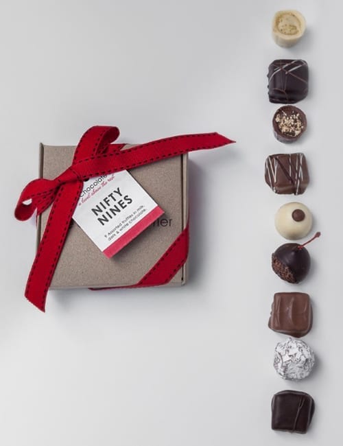 Artisan chocolate gift box with assorted chocolates on display