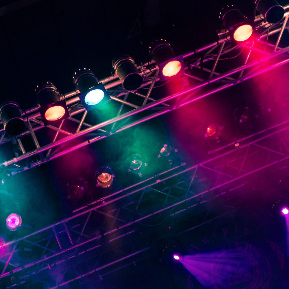 Colorful stage lighting with various lights and fog effects
