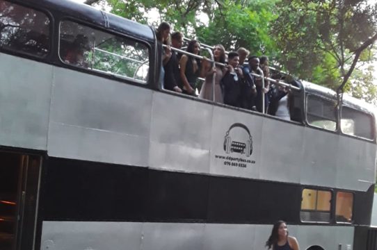 Group of guests on the upper deck of a Double Decker Party Bus