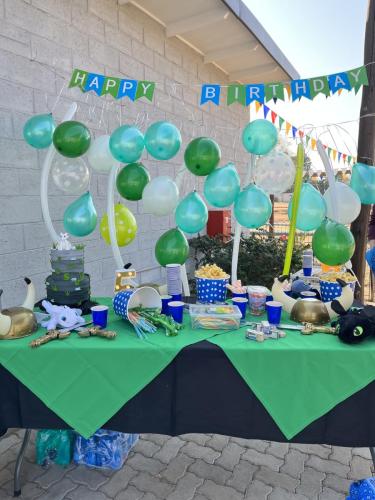 Birthday celebration table with balloons and decorations