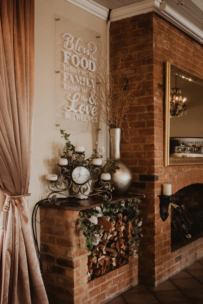 Reception hall decor with a brick wall and elegant elements