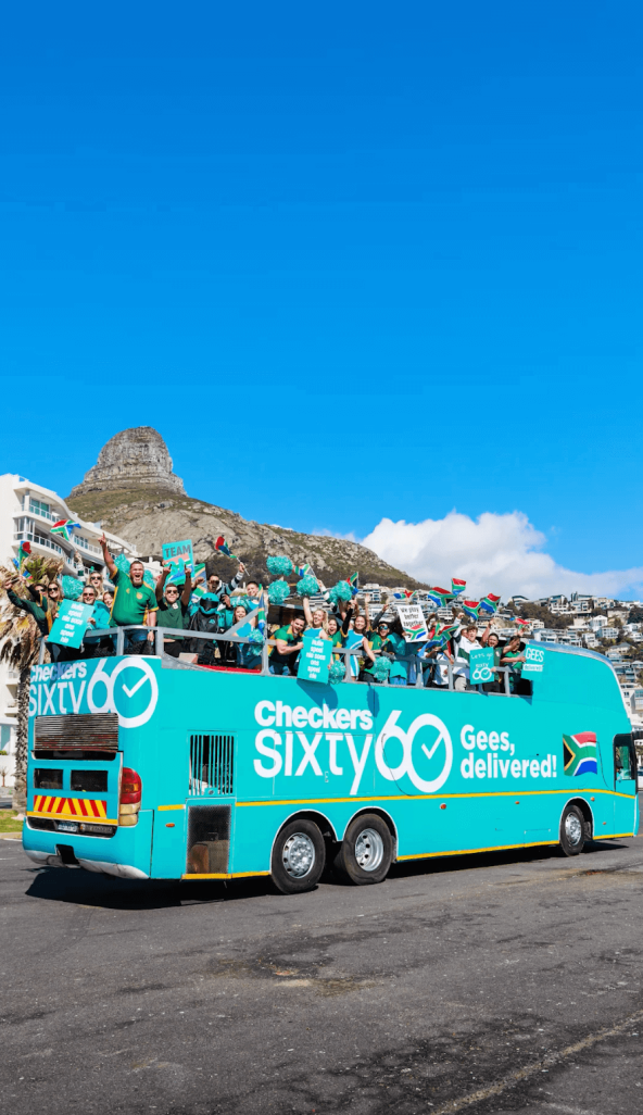 Open-top party bus with cheerful group on board