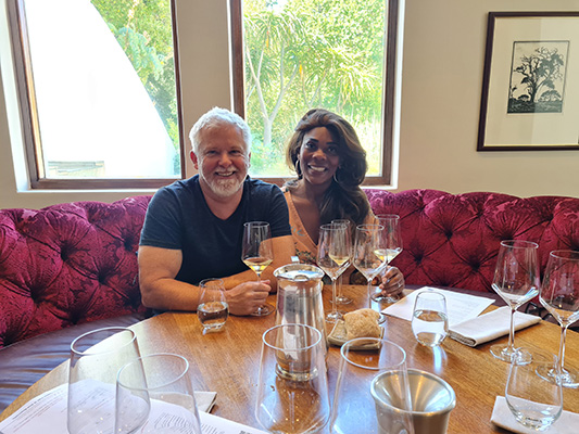 Couple enjoying wine tasting at a beautifully set table