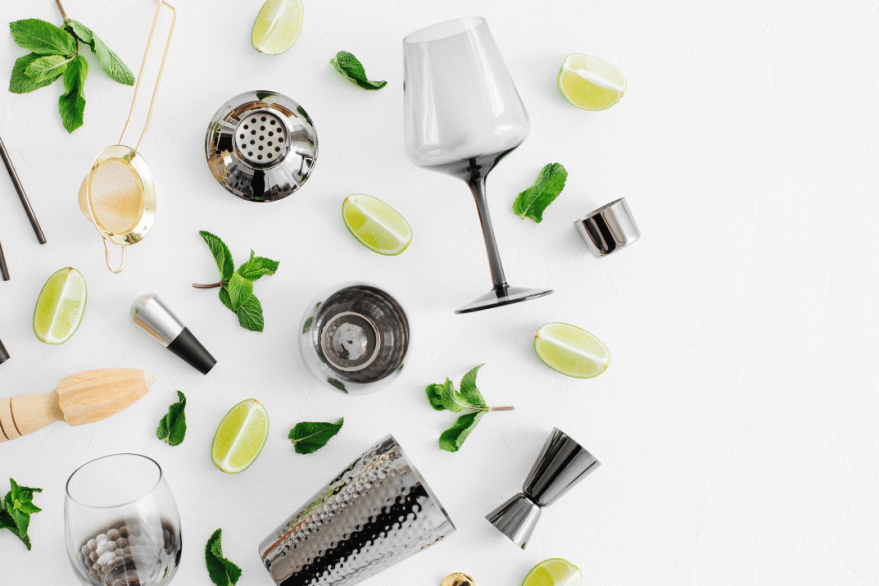 Cocktail preparation tools and fresh ingredients spread out
