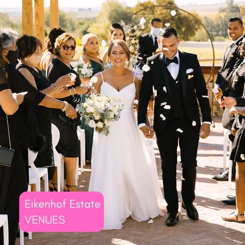 Newlyweds exiting their ceremony at Eikenhof Estate