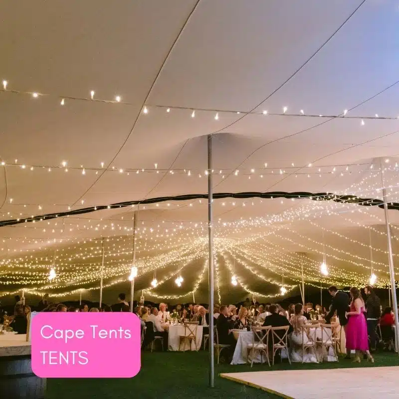 Marquee tent with string lights and elegantly set tables