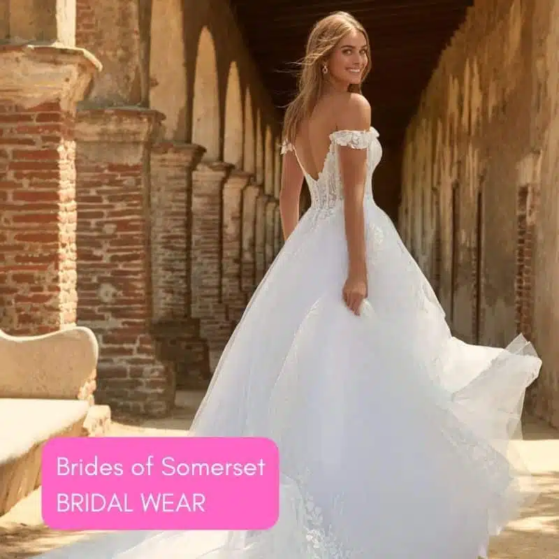 Bride in off-the-shoulder wedding gown in outdoor setting