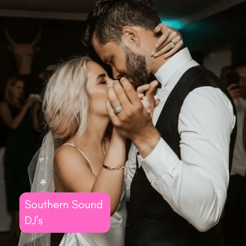 Bride and groom dancing closely at wedding