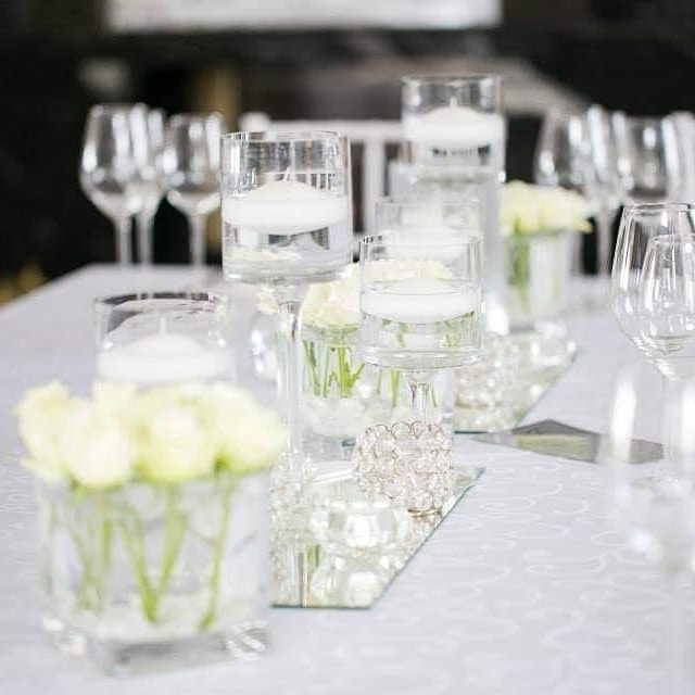 Table centrepieces with candles and flowers