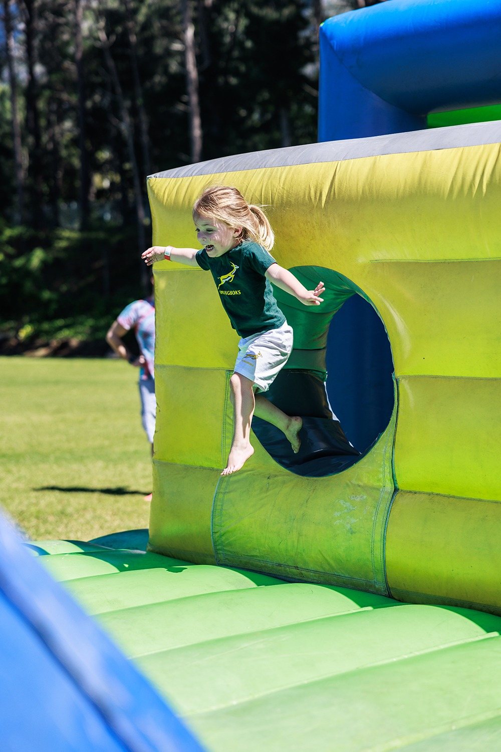 Child jumping through inflatable obstacle in Tuff Nutterz SA course.