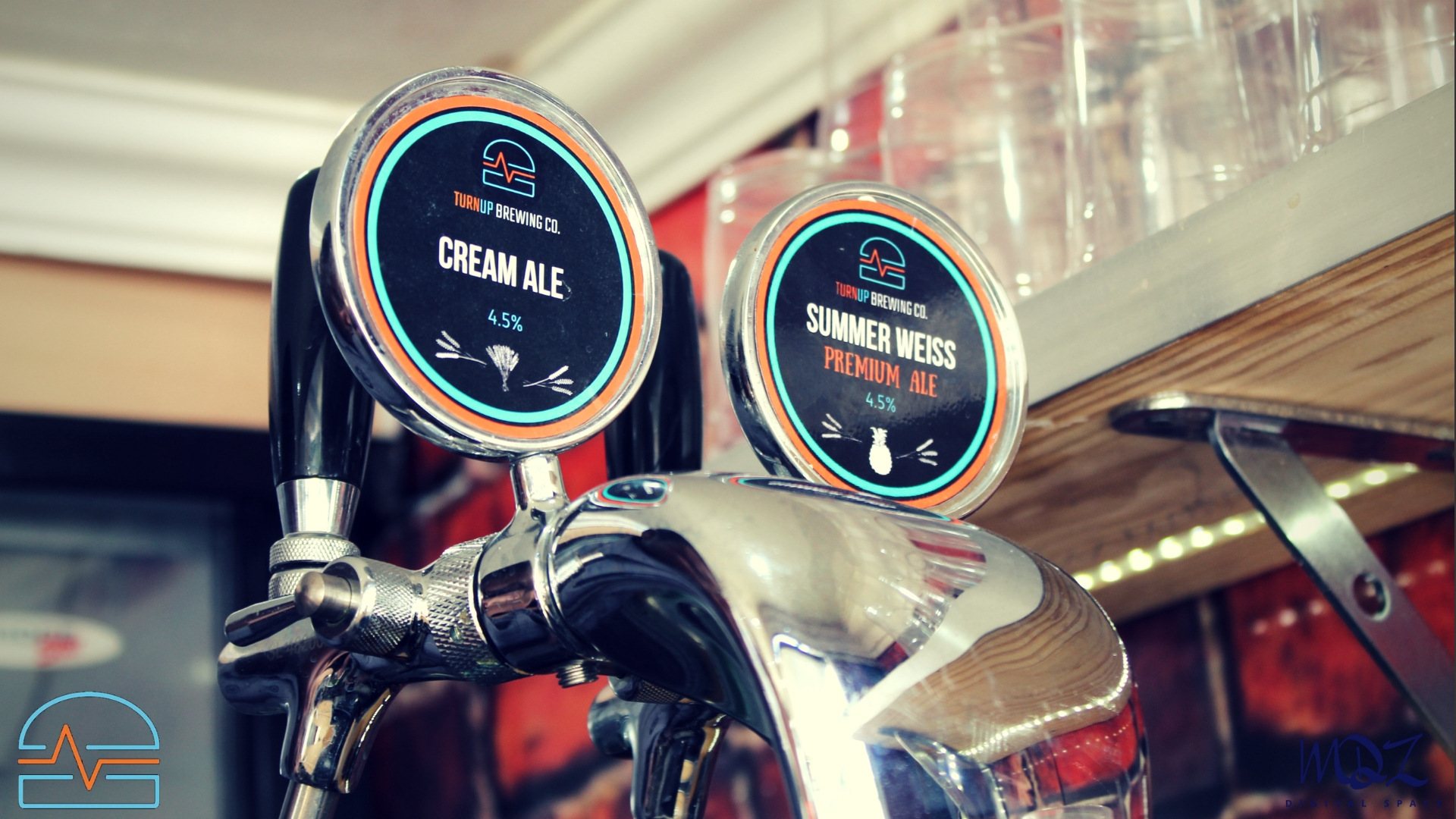 Two beer taps labeled Cream Ale and Summer Weiss