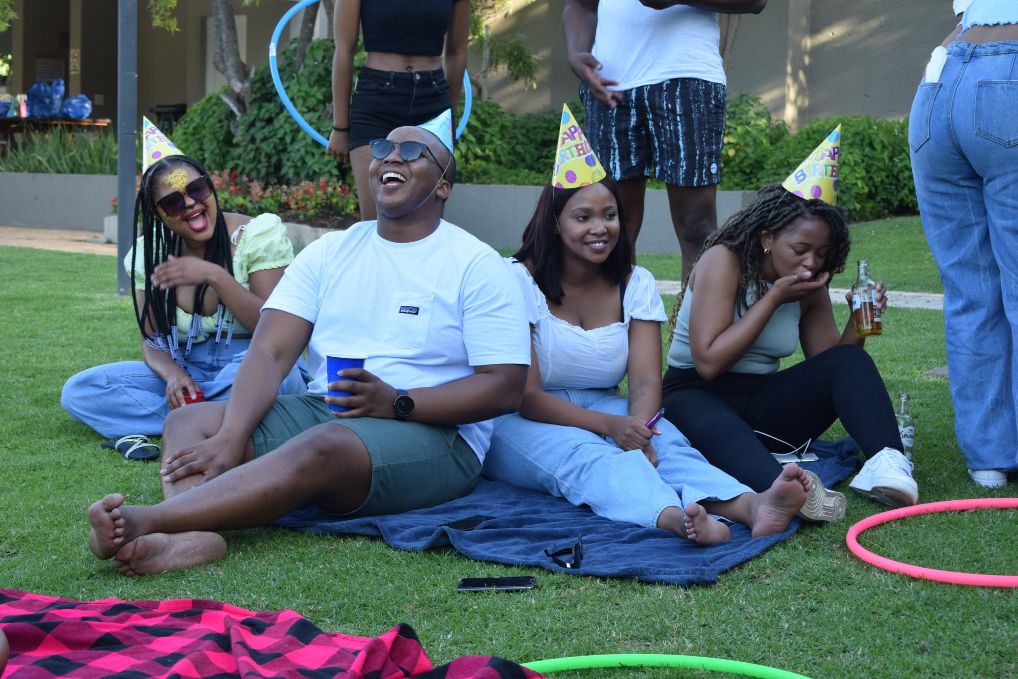 Group of friends enjoying an outdoor party with games and laughter