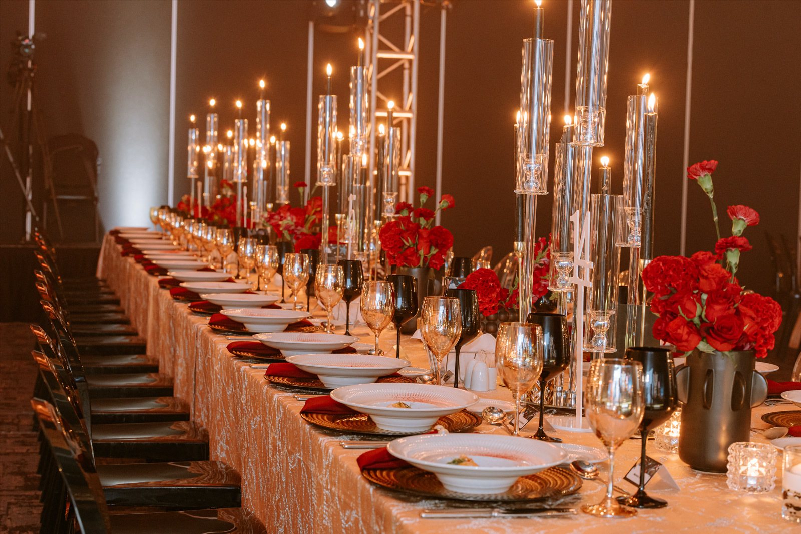 Long dining table set with flowers and candles