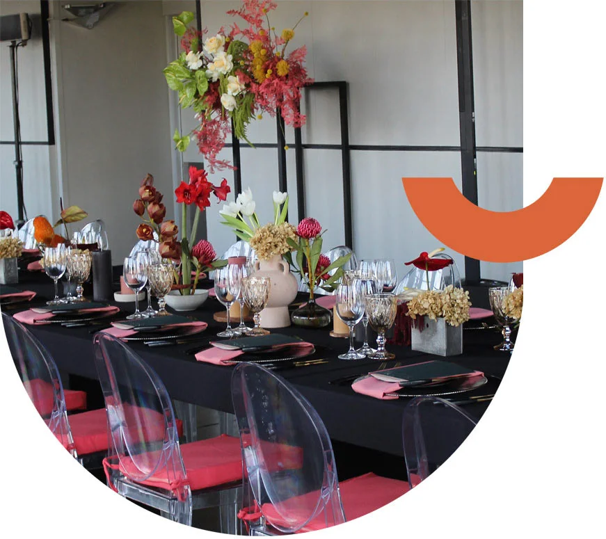 Stylish table setting with flowers and dinnerware