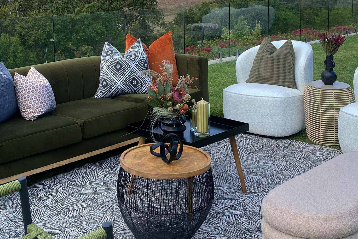Stylish outdoor lounge furniture with cushions and decor