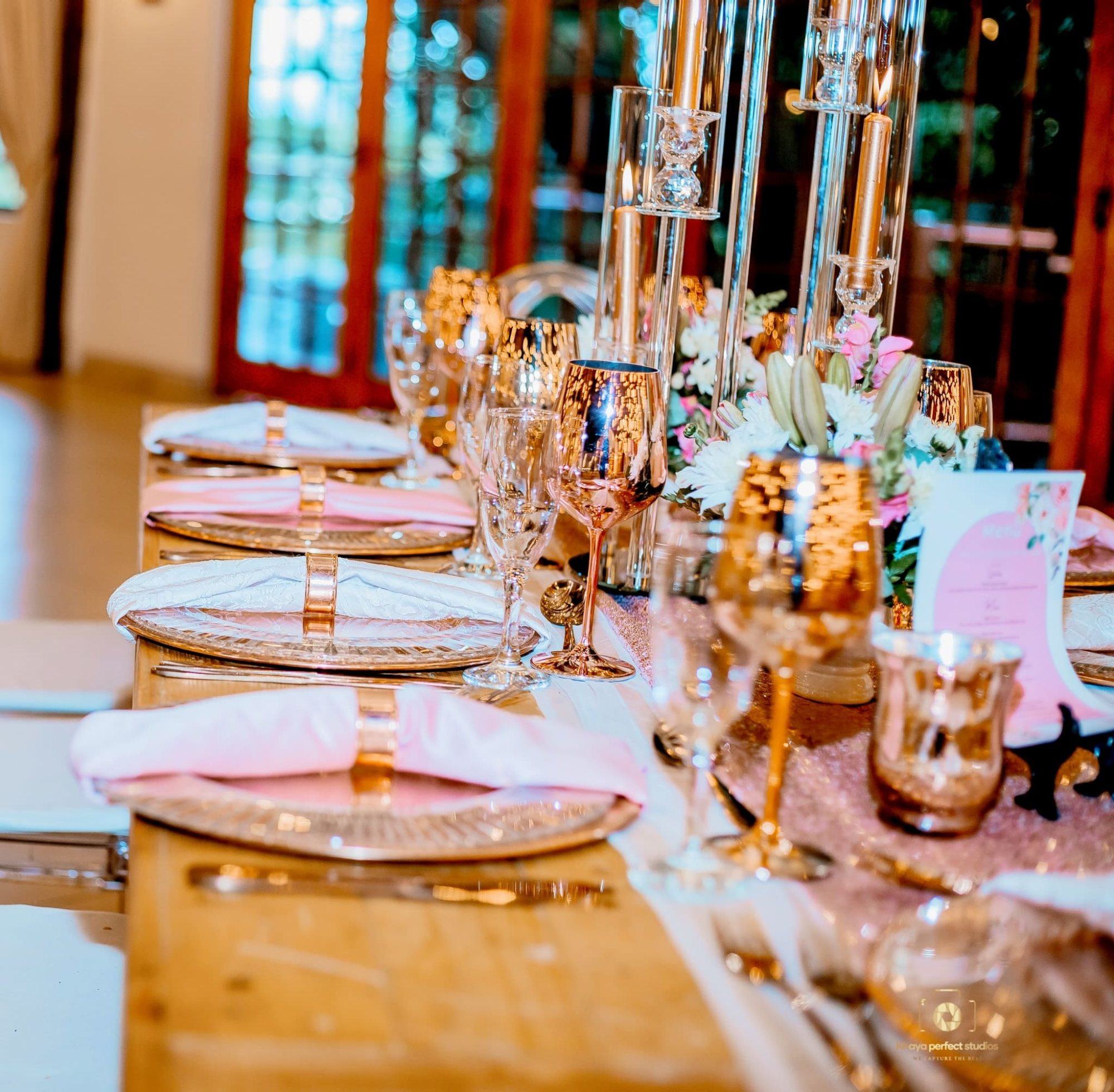 Table set with gold and pink decor for an event