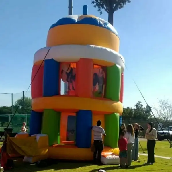 Colorful inflatable bounce house with children playing inside