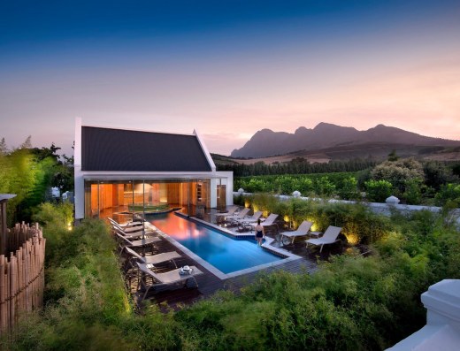 Outdoor chapel venue with pool and mountain backdrop