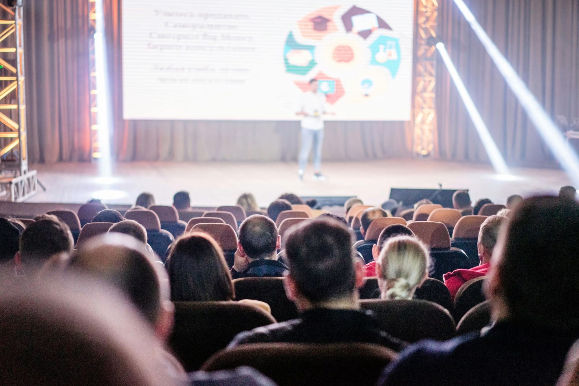 Audience seated during a corporate presentation on stage
