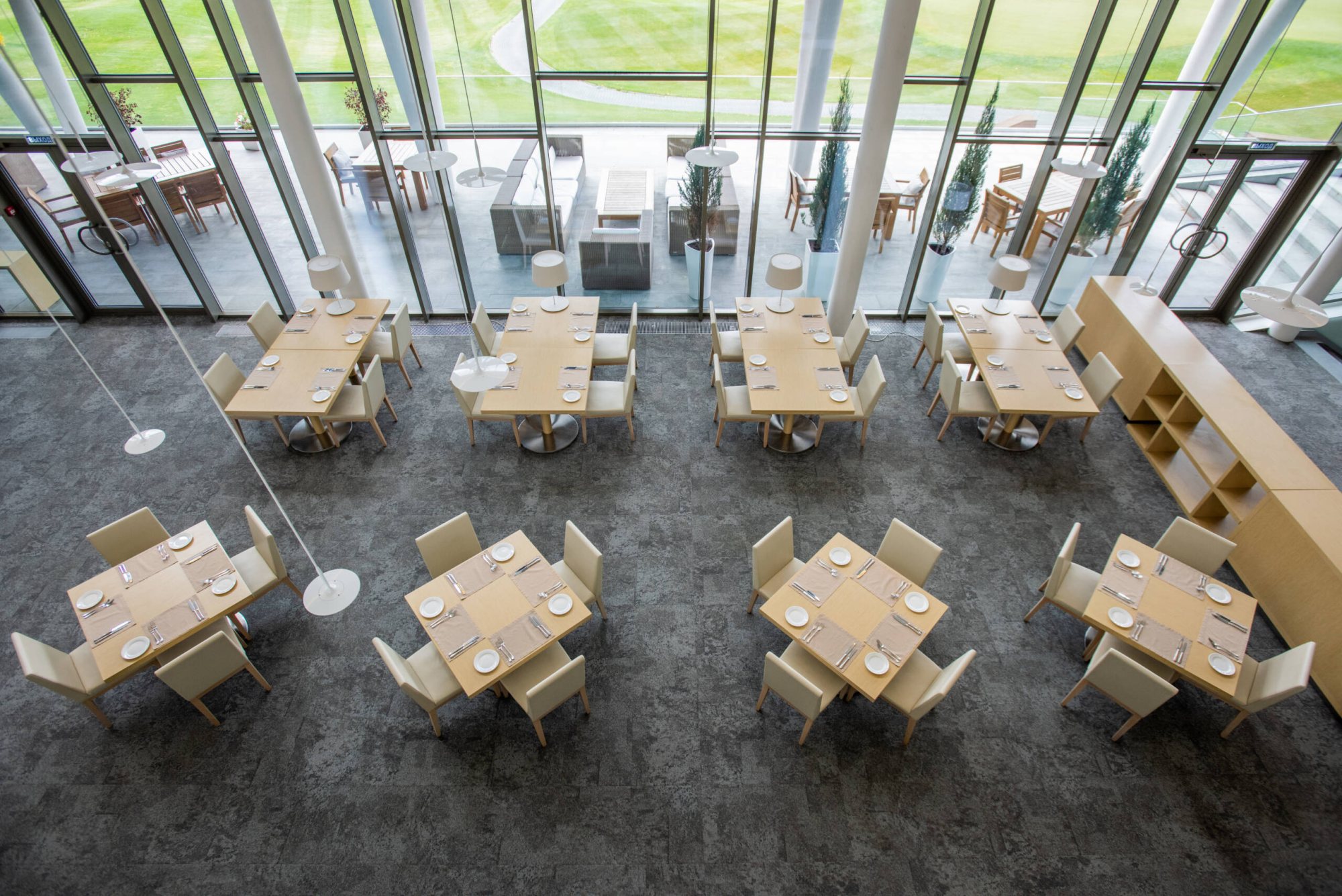 Aerial view of dining room with tables arranged in a spacious layout