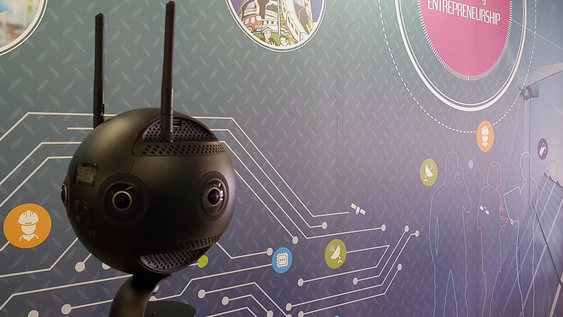 Virtual reality camera setup against colorful wall graphics