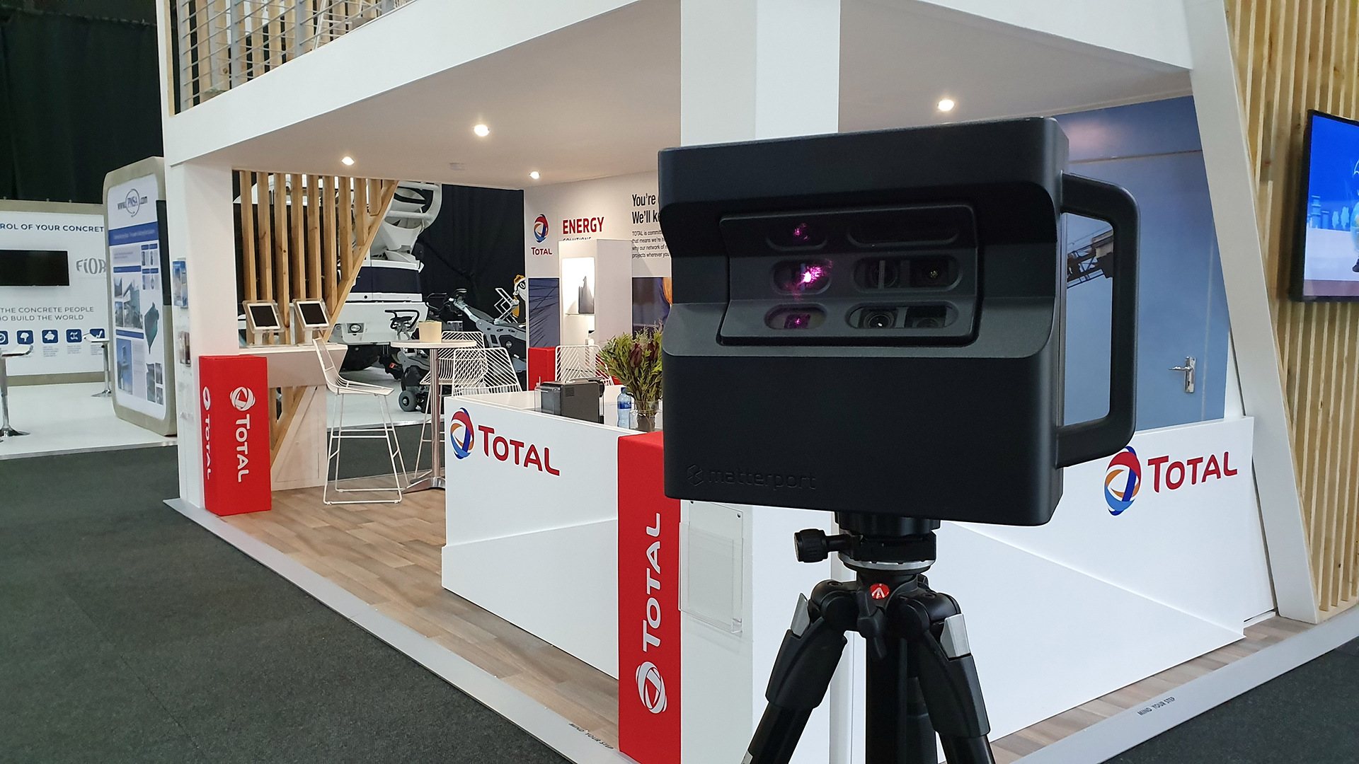 Event activation booth with Total branding and equipment.