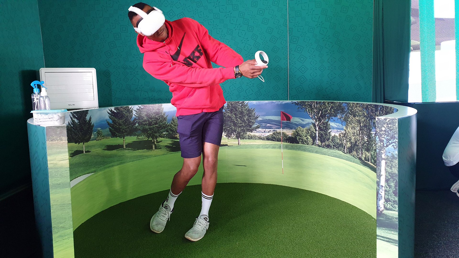 Person playing golf in a virtual reality setup