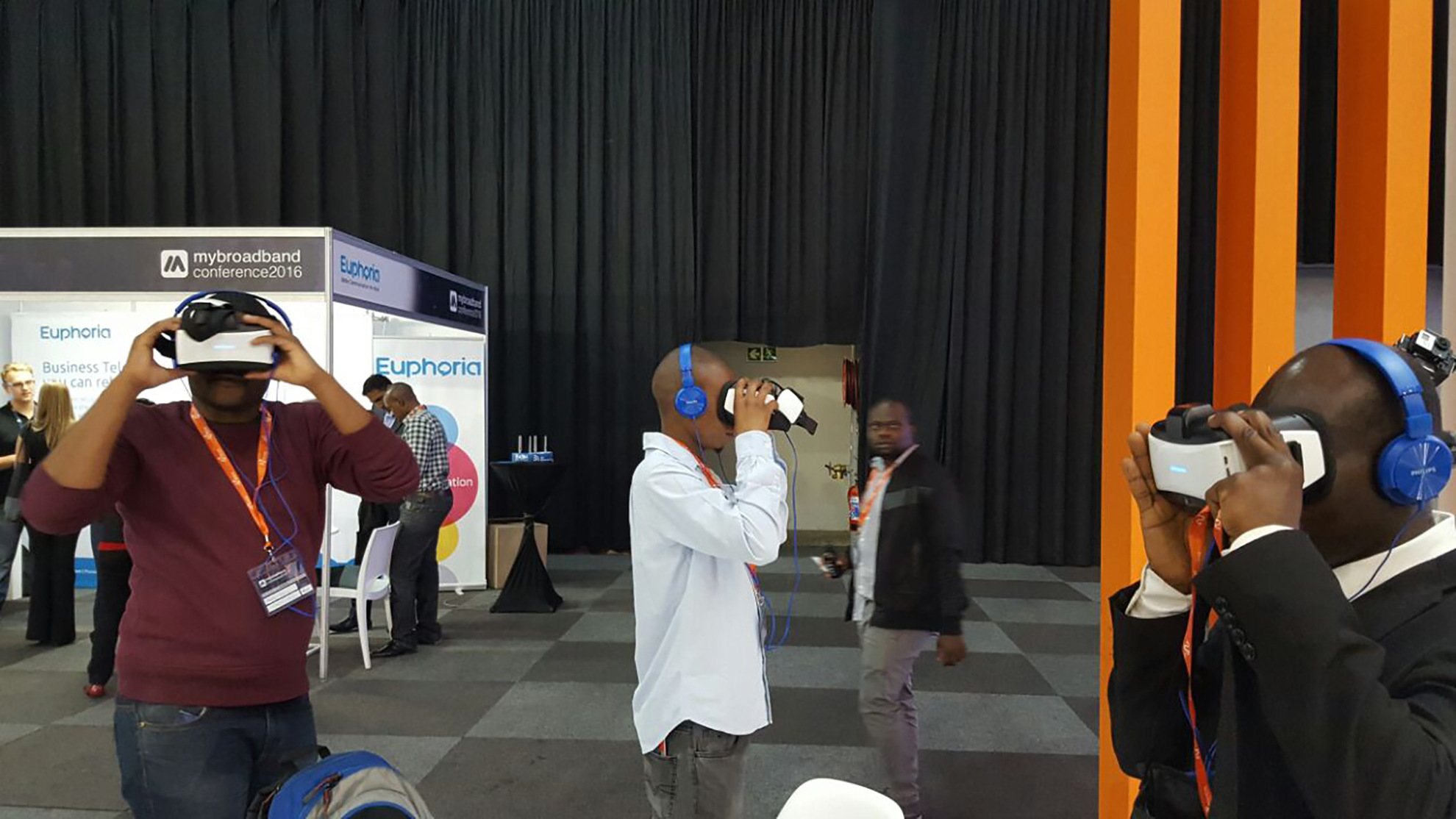 Participants using VR headsets at a conference