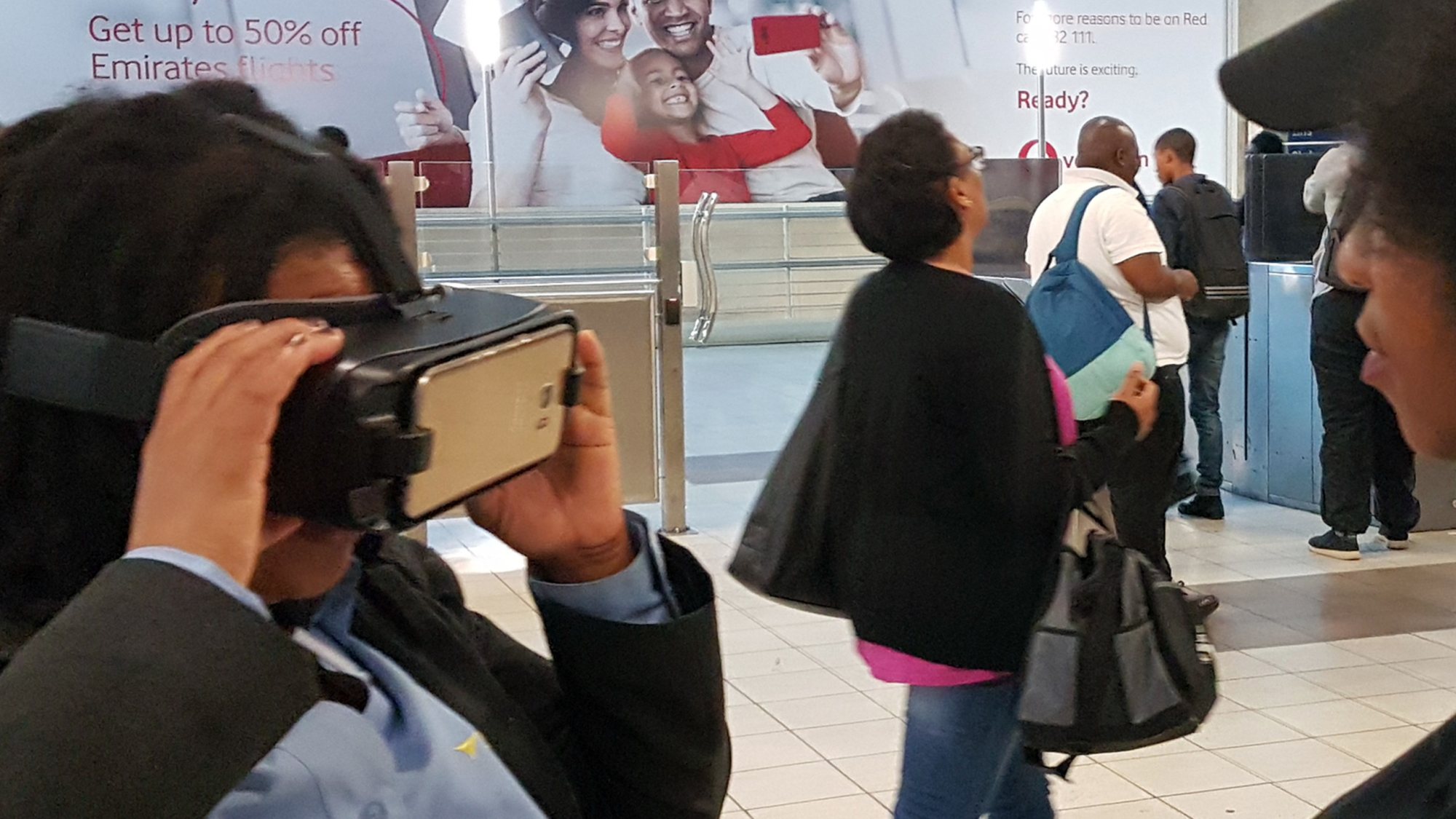 Guest using a VR headset in a busy event space