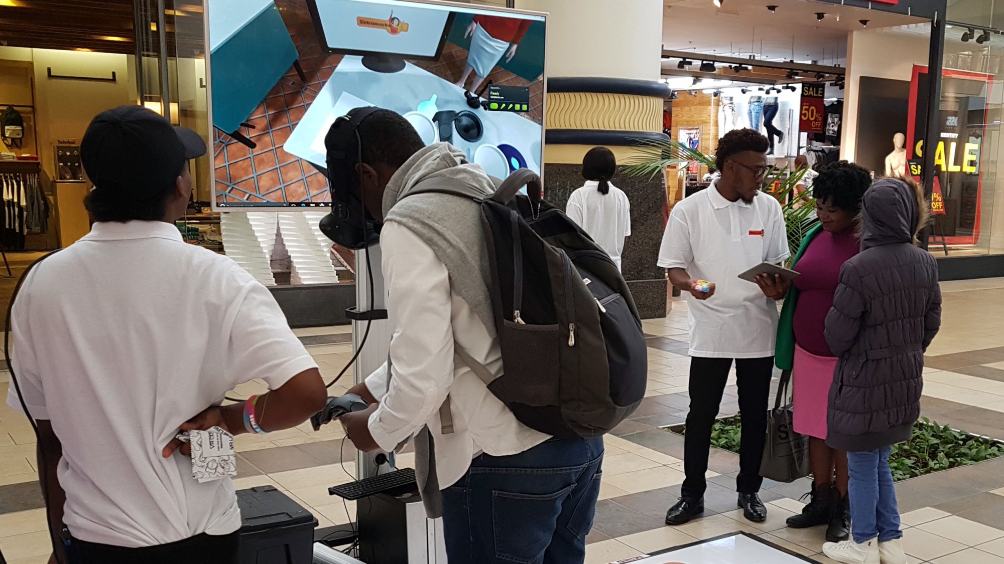 Participants using virtual reality headsets at an event