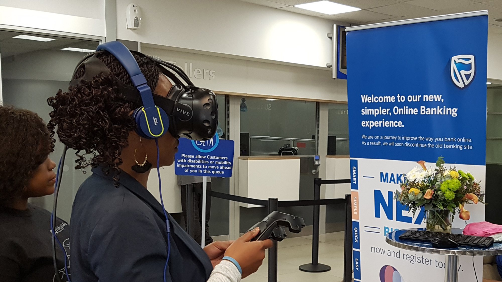 Participant using HTC Vive VR headset at a banking event