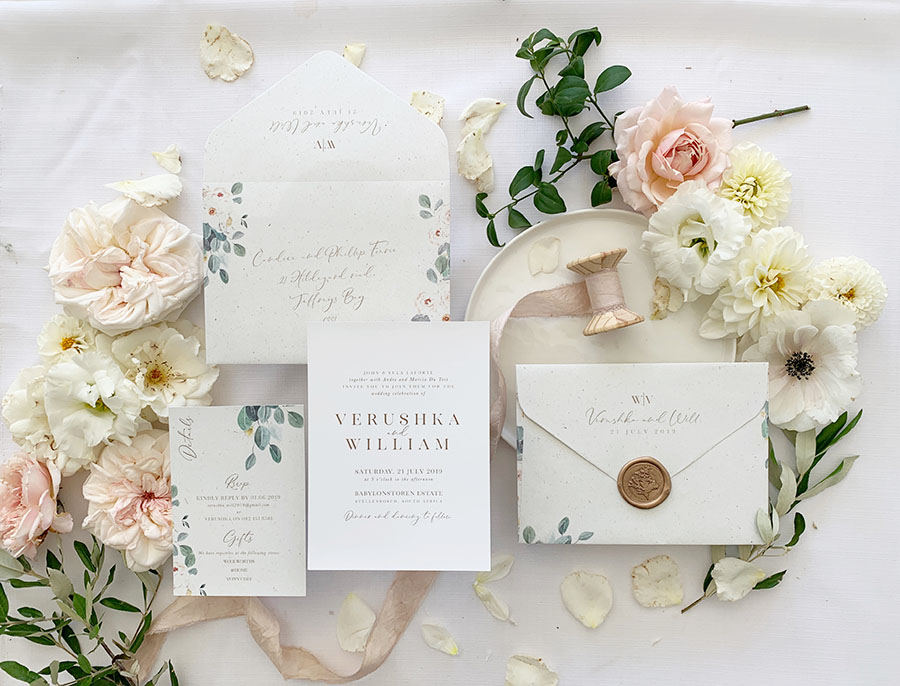Elegant custom wedding invitation suite with floral accents