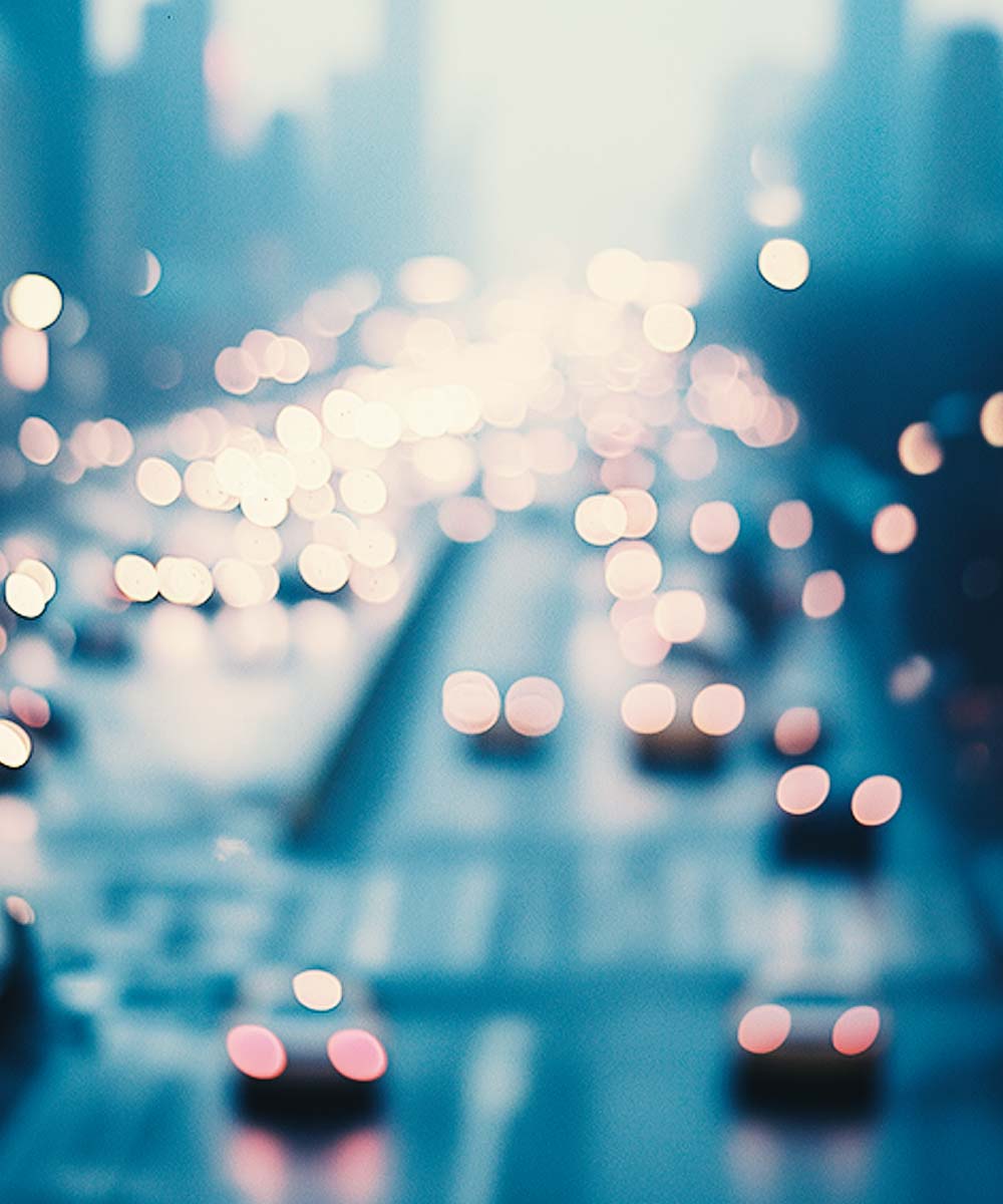 Blurred city traffic scene with lights and vehicles