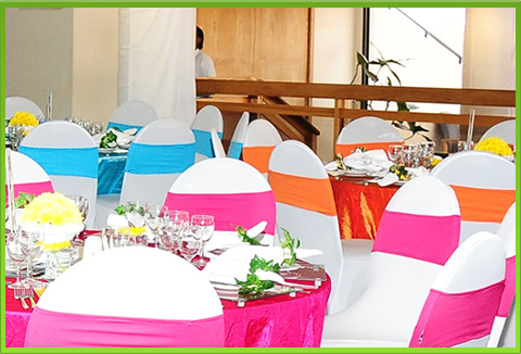 Colorful table settings with decorated chairs and tableware