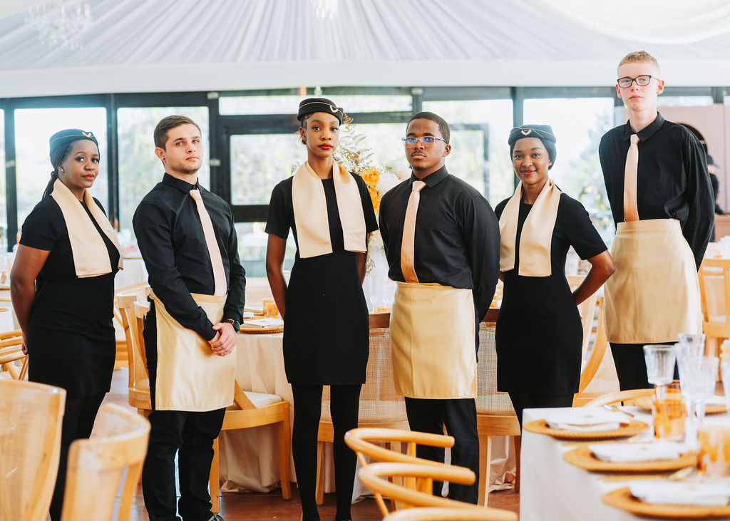 Group of professional event staff in formal attire