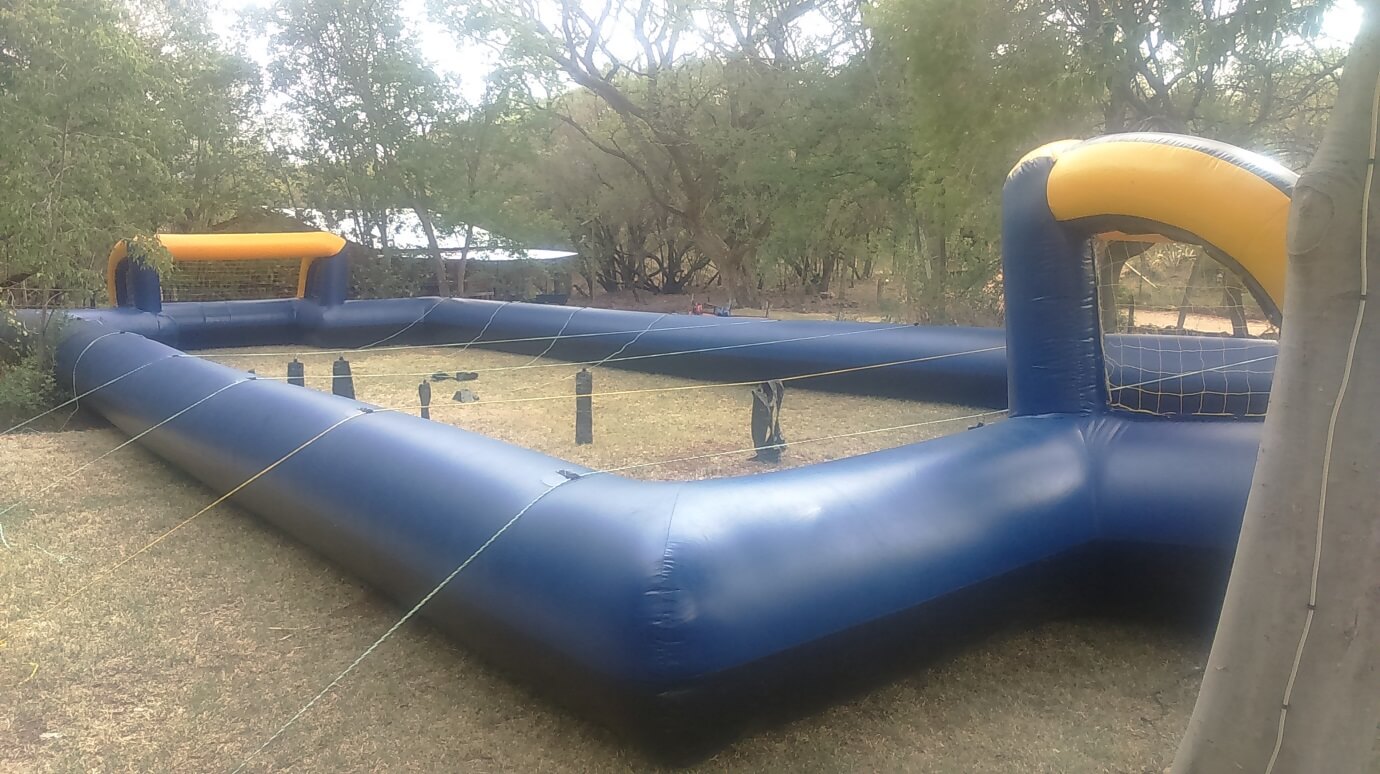 Inflatable volleyball court set up in an outdoor area