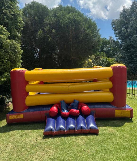 Gladiator Water Slide setup in a garden