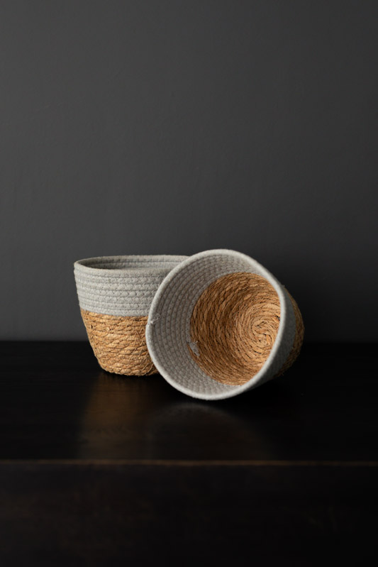 Two stylish storage baskets in natural fibers.